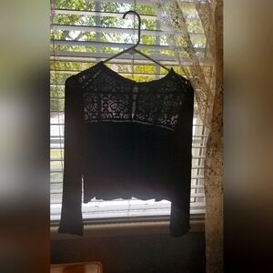 Sweet size medium long sleeved black sweater. Beautiful detail